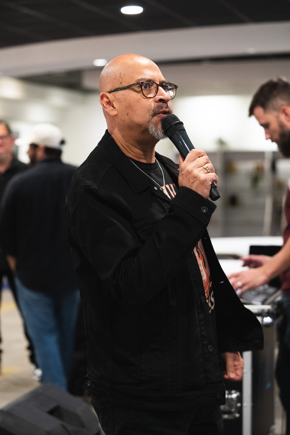 A leader welcoming the room at Guys Night
