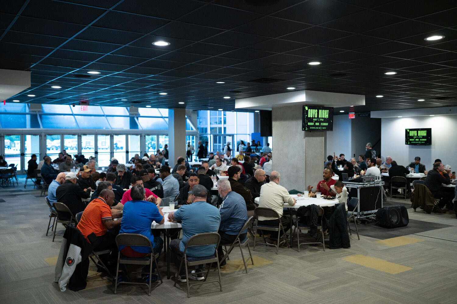 The room filling up for Guys Night at the North Campus